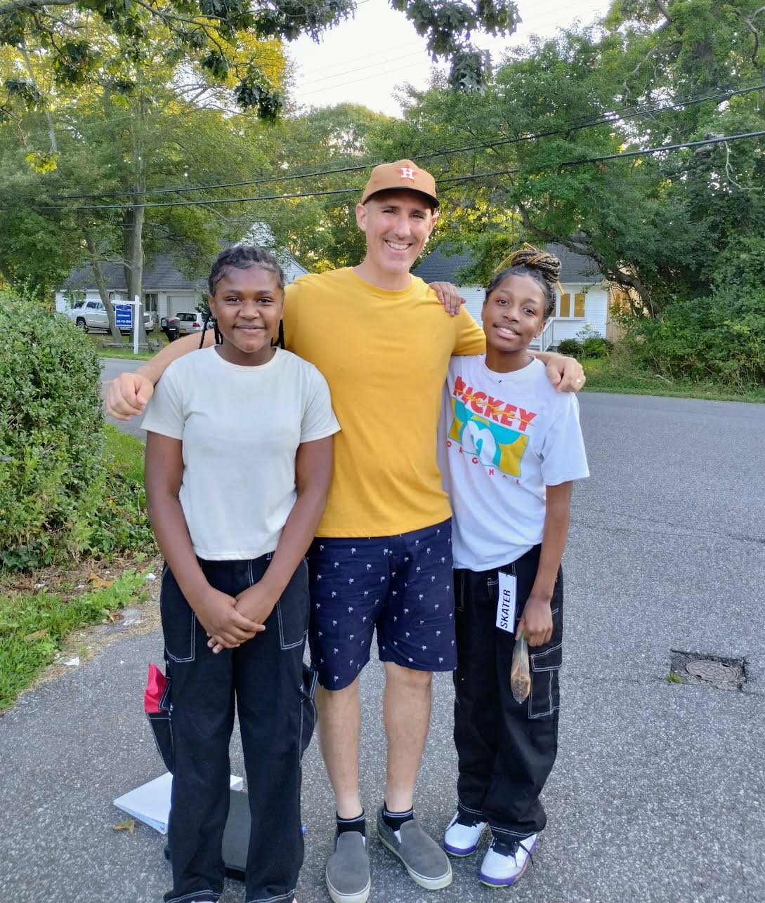 Erica and Eriyonna, both headed to PACA Middle School, pose with founder of Kings Kids Christian Outreach group, PJ Balzer.
